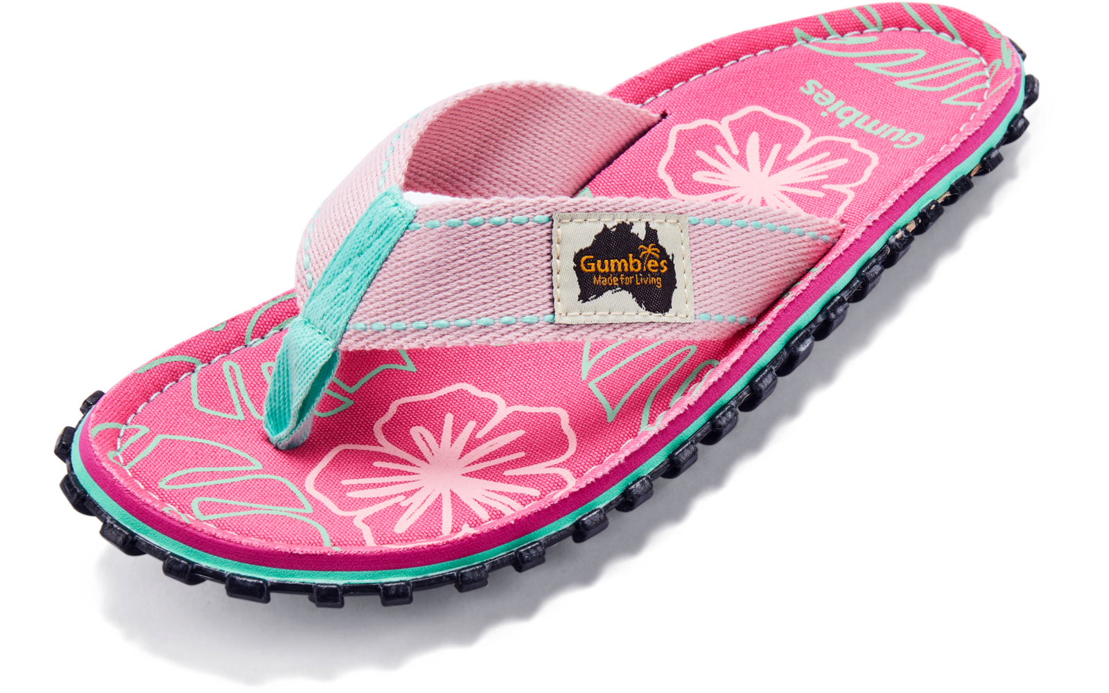 Rosa Flip-Flop mit weißem Blumenmuster, türkisfarbenem Stoffzehensteg, Etikett "Gumbies" und schwarzer profilierter Sohle