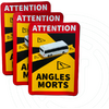 Drie deels overlappende rode en gele waarschuwingsstickers met een wit buspictogram, zwarte diagonale strepen, gele driehoekige waarschuwingssymbolen met uitroeptekens en de woorden 'ATTENTION' bovenaan en 'ANGLES MORTS' onderaan