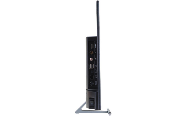 Schlanker Flachbildschirm im Profil auf Metallfuß; sichtbare Anschlussleiste mit HDMI-, Koaxial-, zwei USB-, Ethernet-, Audio- und Netzanschluss