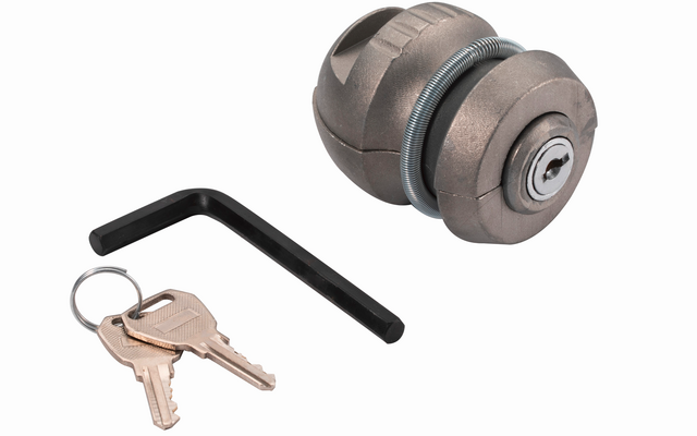 Two round metallic cylinders with keyholes, a black L-shaped hex key, and two keys on a key ring on a white background