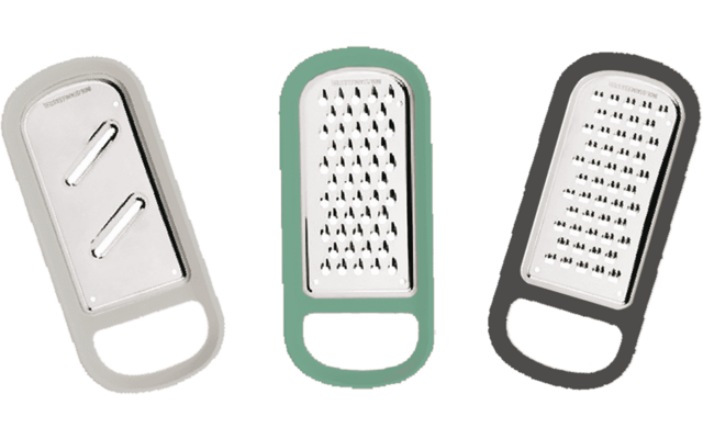 Three different kitchen graters with handles in different colors
