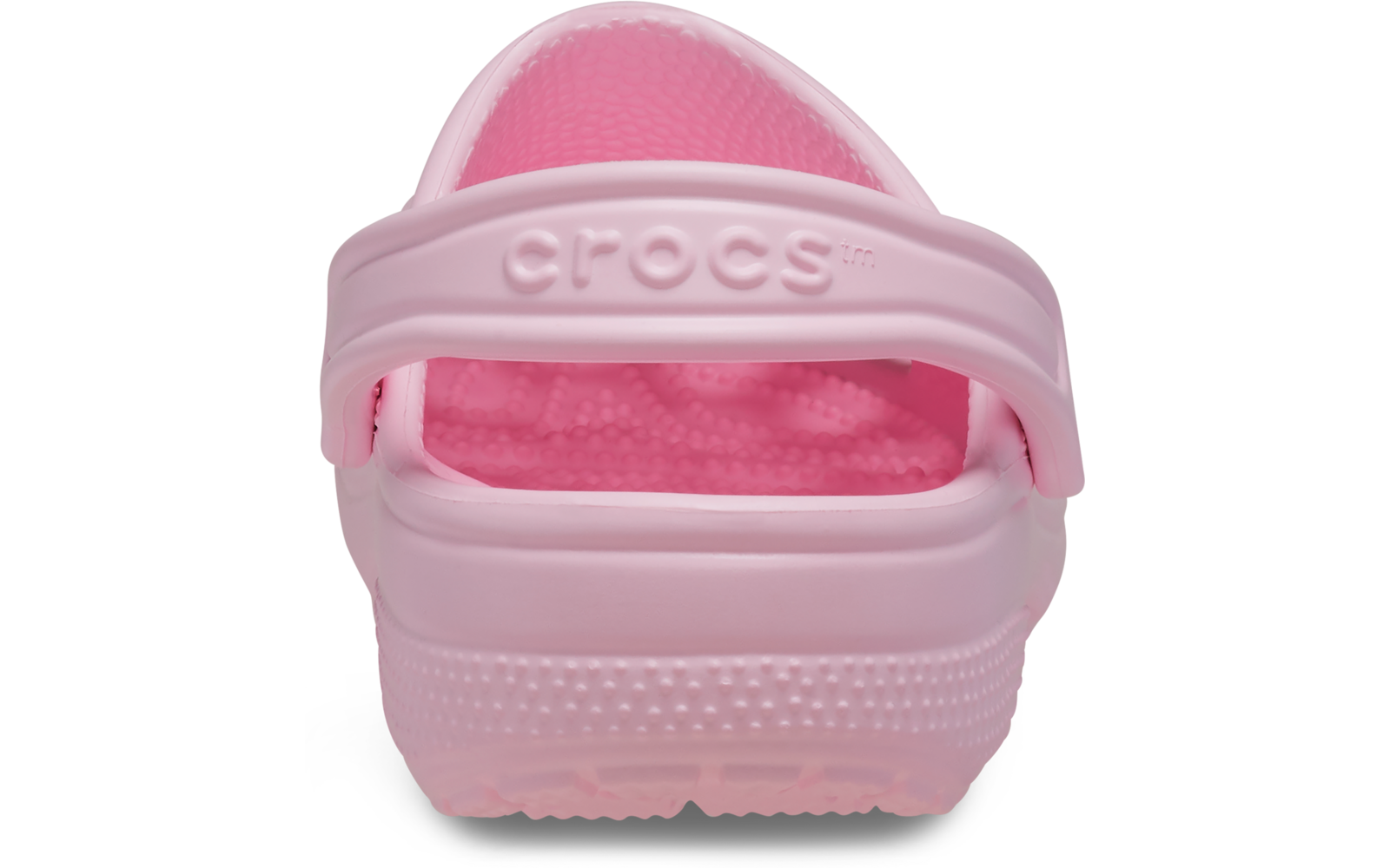 Rosa Clog von hinten mit hochgestelltem Fersenriemen, geprägtem "crocs"-Schriftzug, strukturierter Innensohle und geriffelter Sohle
