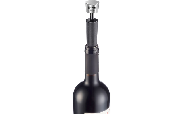Top half of a dark wine bottle, visible cork and a silver metal piece with a round head and two thin rods placed on the cork