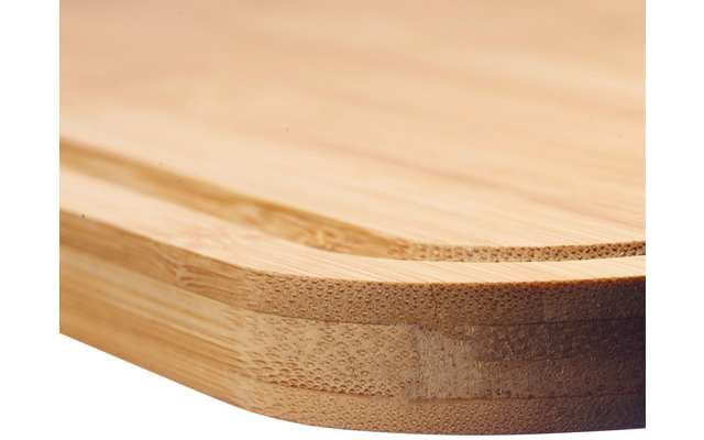 Close-up of a rounded corner of a wooden board showing layered edges and wood grain