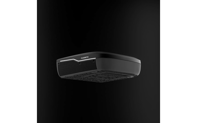 Schwarzes, rechteckiges Gerät mit abgerundeten Kanten, Frontgitter, Unterseite mit Lüftungsgittern und Text 'DOMETIC' auf der Vorderseite