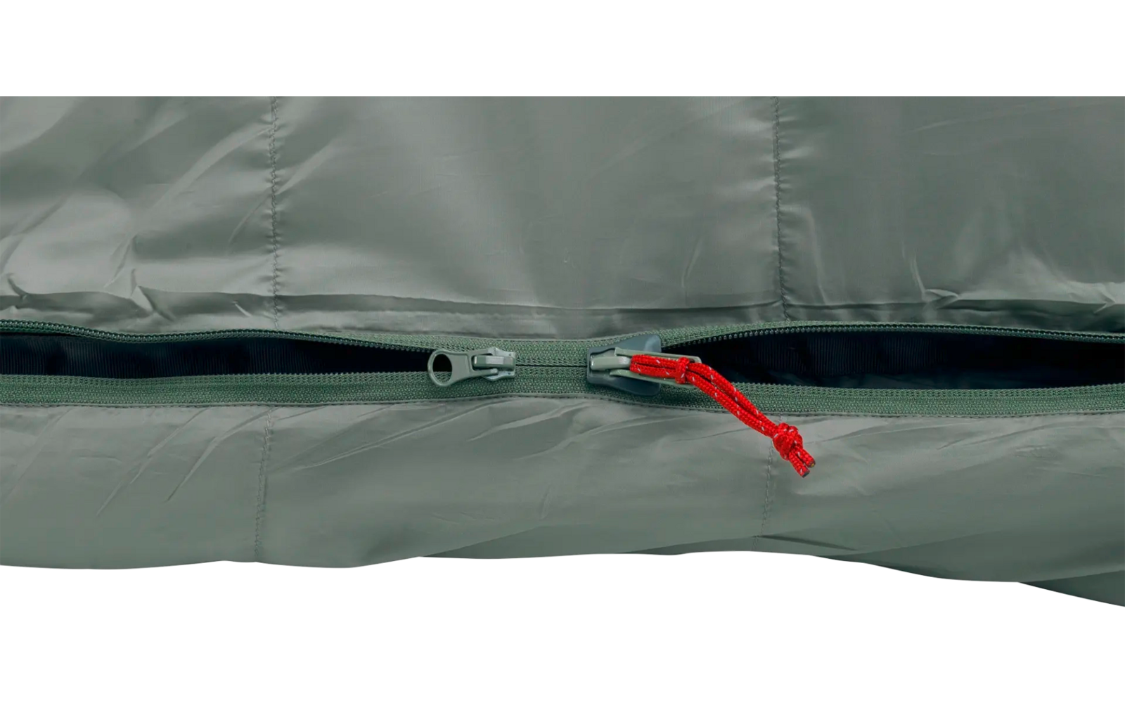 Nahaufnahme eines dunklen Reißverschlusses auf grauem Stoff