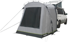 Gray tent with black mesh window and green trim, attached to the open roof hatch of a white van; guy lines and support poles visible