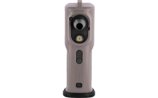 Front view of a rose-colored handheld device with a round black outlet at the top, a smaller round opening below, a yellow-lit circular element, two round buttons, three status LEDs and a black base