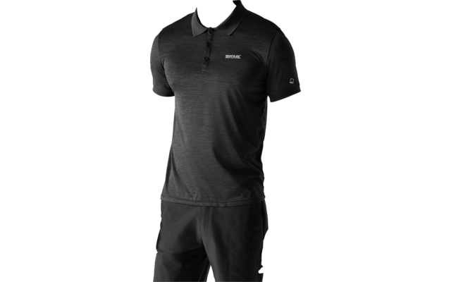 Man wearing a dark gray short-sleeve polo with a small chest logo and dark pants, standing against a light plain background; visible forearm tattoo