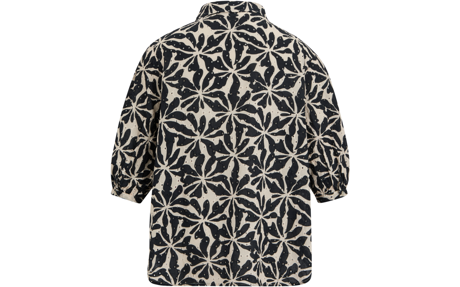 Rückansicht eines kurzärmligen Oberteils mit schwarzem und weißem Muster aus großen sternförmigen Motiven