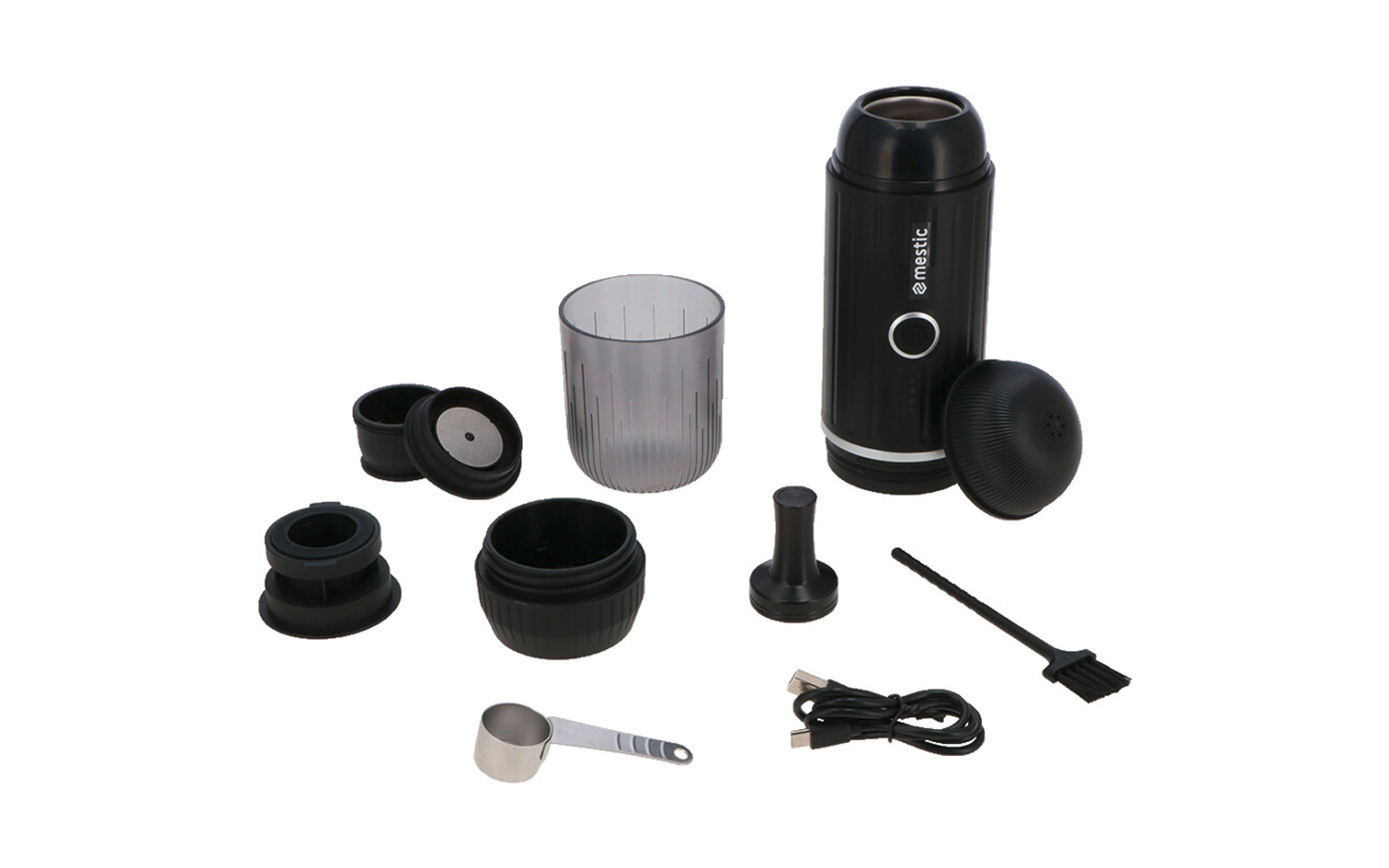 Schwarzes zylindrisches Gerät mit verschiedenen losen Zubehörteilen: transparenter Plastikbecher, mehrere runde schwarze Deckel und Ringe, kleiner Metallmesslöffel, schwarzes USB-Kabel und kleine Reinigungsbürste auf weißem Hintergrund