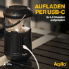 Zwarte draagbare lamp op houten ondergrond met tekst 'Opladen via USB-C in 4,5 uur volledig opgeladen'