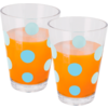 Two clear glasses with orange liquid and light blue polka dots