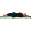 Person with short blond hair wearing a black top and black leggings lies on their side on a green pad on a white foam mattress with round holes