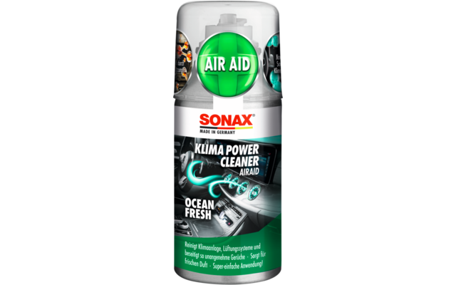 Aérosol métallique avec logo Sonax, emblème vert 'AIR AID', texte 'KLIMA POWER CLEANER' et 'OCEAN FRESH', étiquette montrant l'habitacle d'une voiture