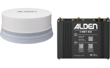 Dispositivo redondo blanco con base gris a la izquierda; carcasa metálica rectangular negra a la derecha con la inscripción 'ALDEN I-NET 512', códigos QR, etiquetas y varios conectores
