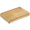 Rectangular light wooden cutting board with rounded corners, groove around the edge and a round hole in one corner on a white background