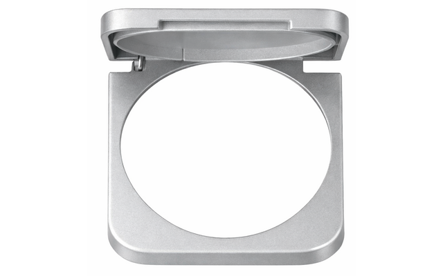 Open silver metal case with square outer frame and circular cutout in the center, hinged lid open