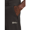 Ein Arm steckt in der Gesäßtasche einer schwarzen Hose