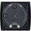 Square black frame with a central round dark-gray lid showing embossed text '230V~AC ABS'; two silver screws at the bottom edge of the lid