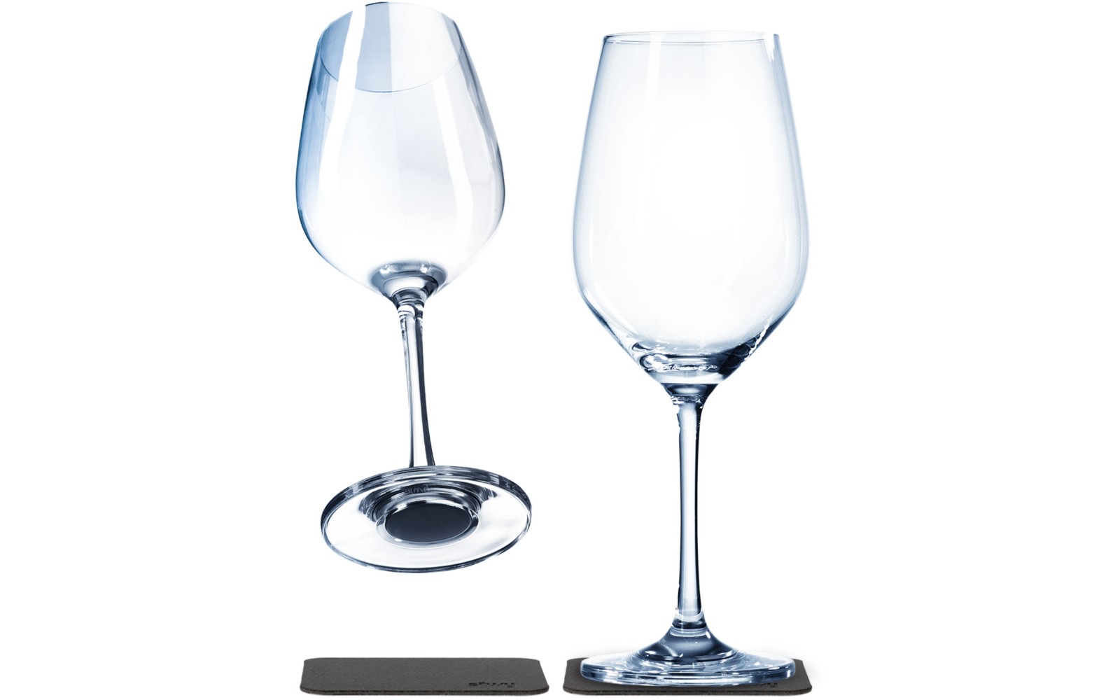 Two clear wine glasses on a white background; one stands on a rectangular dark coaster, the other is tilted