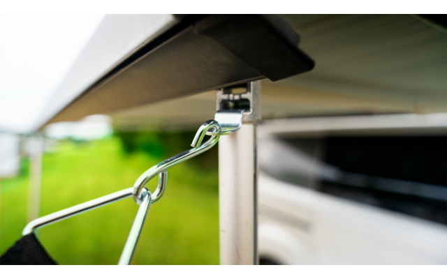 Close-up of a metal hook on a white vehicle