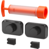 Orange tubular hand pump above two black rectangular pieces with circular protrusions and two small black rectangular inserts
