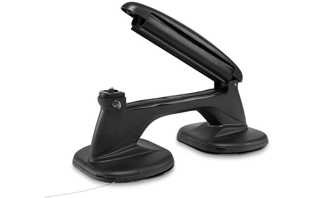 Oggetto nero in plastica con due ventose rotonde collegate da una maniglia; leva superiore aperta; sfondo bianco