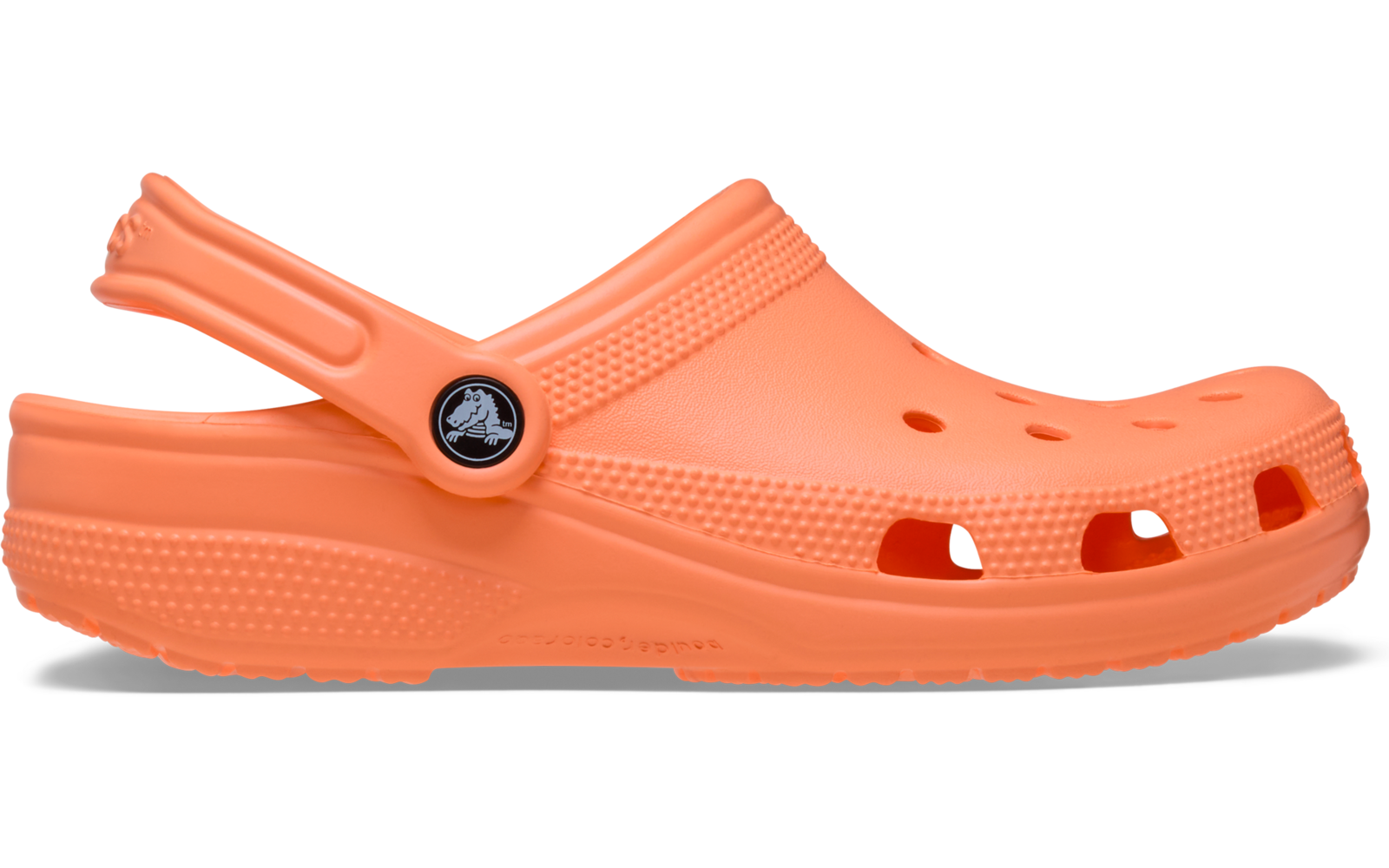 Oranger Gummi-Clog (linker Schuh), Seitenansicht, mit Fersenriemen und Belüftungsöffnungen