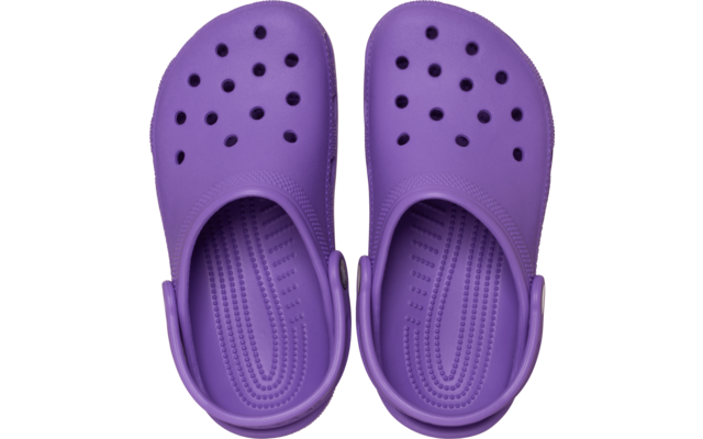 Deux sabots violets vus de dessus, chacun avec zone perforée à l'avant, semelle intérieure texturée et brides de talon rabattues vers l'arrière