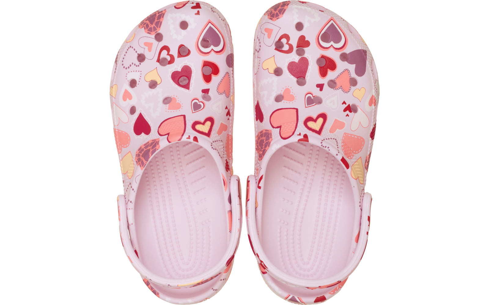 Paire de sabots roses à motif de cœurs multicolores, vue de dessus, brides de talon et semelles intérieures rainurées