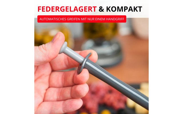 Main tenant une tige grise avec un disque rond; en arrière-plan viande hachée et ustensiles de cuisine flous; en haut texte 'FEDERGELAGERT & KOMPAKT' et encadré rouge 'AUTOMATISCHES GREIFEN MIT NUR EINEM HANDGRIFF'