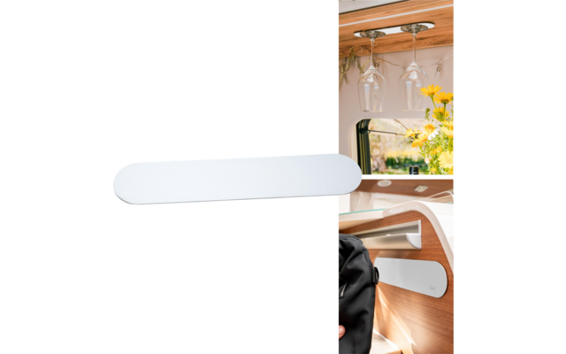 White storage container mounted on the wall inside a camper van with wine glasses and flowers in the background