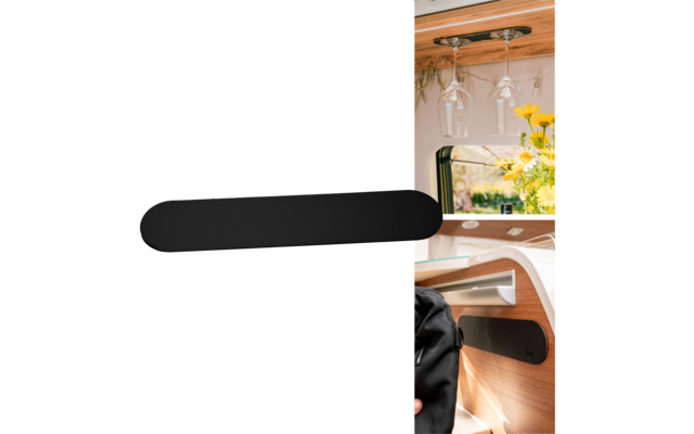 Wood-paneled interior with window, hanging wine glasses, yellow flowers in a vase, long black object attached to the wall, black backpack on a wooden shelf