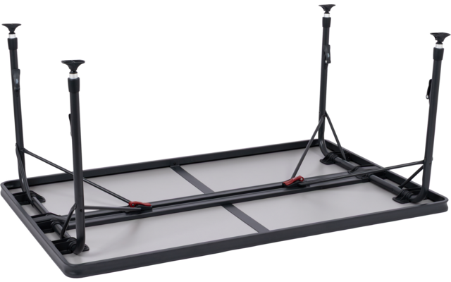 Umgedrehter rechteckiger Tisch mit grauer Tischplatte, schwarzem Metallrahmen, vier ausklappbaren Beinen mit runden Fußkappen und roten Verriegelungsclips