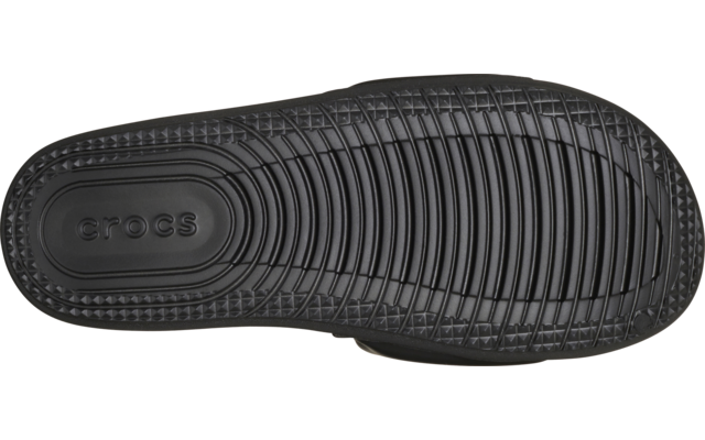 Draufsicht auf einen schwarzen Crocs‑Clog, sichtbare Innensohle mit Rillenmuster und Markenaufdruck „crocs“