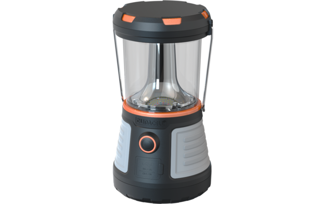 Zwarte en grijze lamp met oranje accenten, transparant cilindrisch midden, ronde aan/uit-knop aan de voorkant en opschrift "DURACELL" op de voet