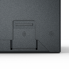Surface gris foncé avec deux vis en forme d'étoile, une trappe rectangulaire avec une fente étroite, un coin inférieur droit biseauté et un fond clair en dessous