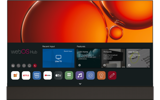 Fernsehbildschirm mit orangenen Blasen-Grafiken oben; darunter dunkle Benutzeroberfläche mit Schriftzug "webOS Hub", Kacheln "Recent Input" und "Features", Vorschau-Karten "Live TV", "Edit Home", "TV Guide", "User Guide" und einer Reihe von App-Symbo