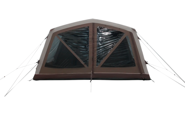 Ein großes braunes und weißes Zelt mit offenem Eingang auf grünem Gras