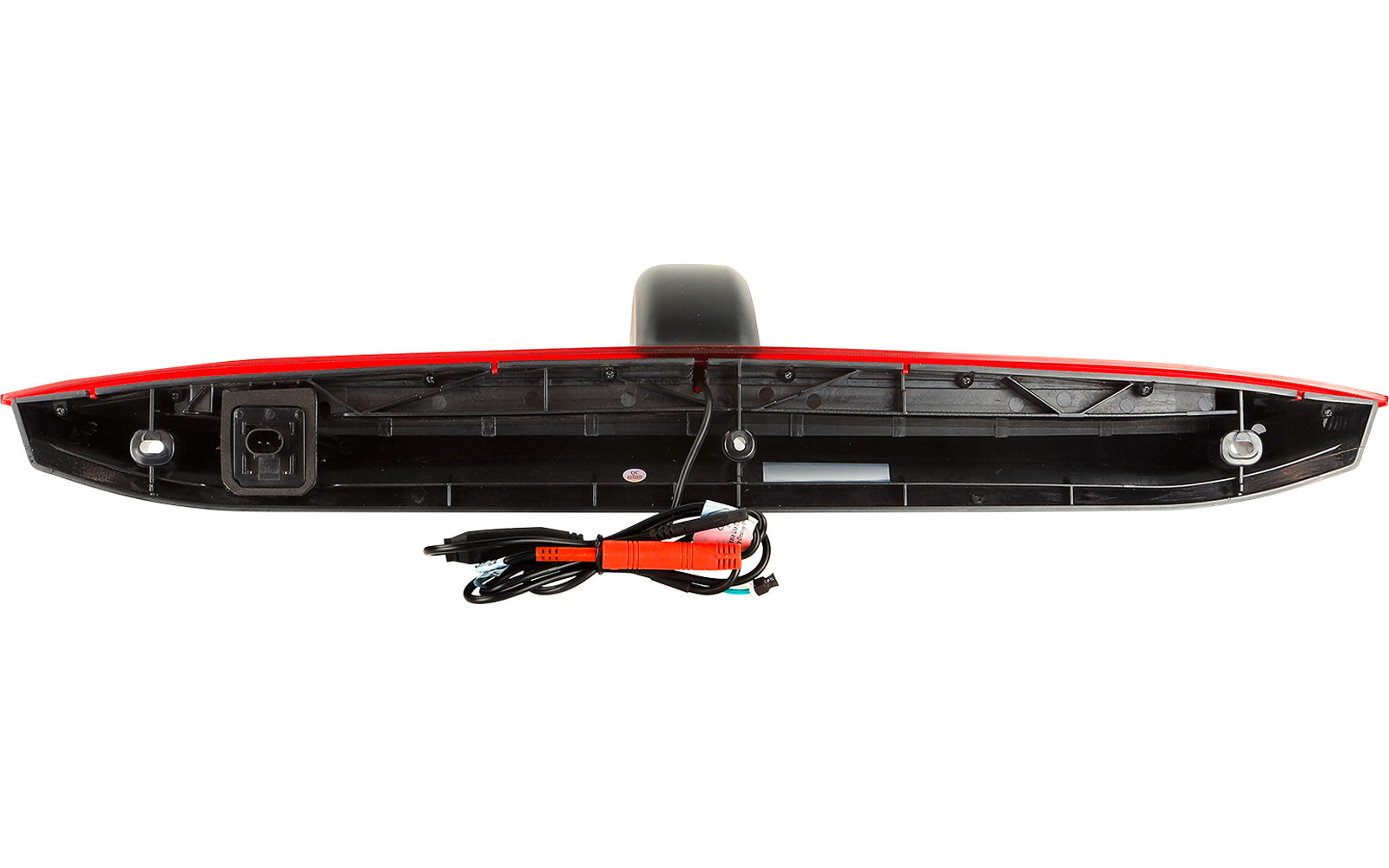 Längliches schwarzes Kunststoffteil mit rotem Rand oben; mittig rundes schwarzes Gehäuse; unten links elektrischer Stecker, mehrere schwarze und rote Kabel, Metallklammern und Schrauben sichtbar
