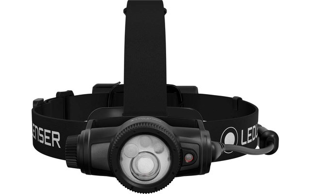 Lampe frontale noire avec LED circulaire, câble latéral et bandeau noir avec inscription blanche "LEDLENSER"