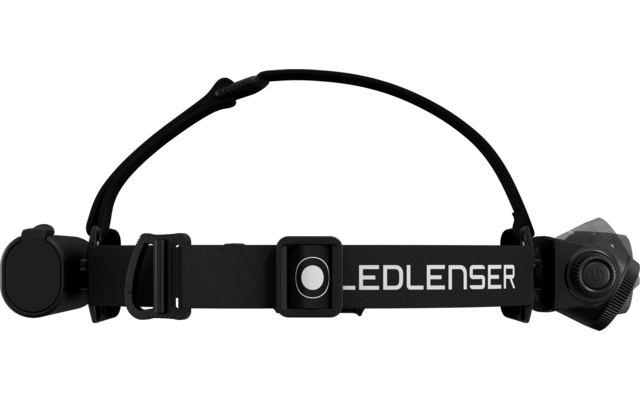 Sangle élastique noire avec inscription blanche "LEDLENSER", au centre un module rectangulaire avec un bouton rond, boîtiers de lampe ronds à gauche et à droite