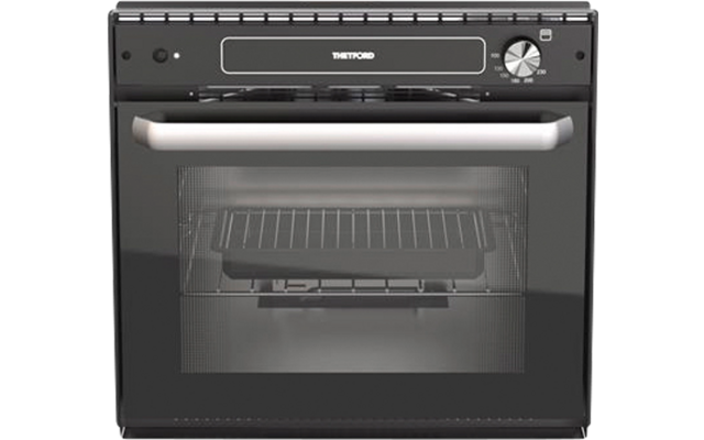 Schwarzer Ofen mit Glastür, Metallgriff, innen sichtbarem Backblech und Bedienfeld mit Drehregler und Schriftzug 'THETFORD'
