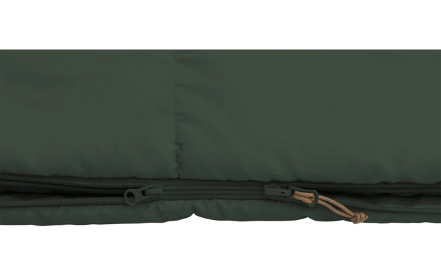 Close-up van een gesloten rits op donkergroen textiel