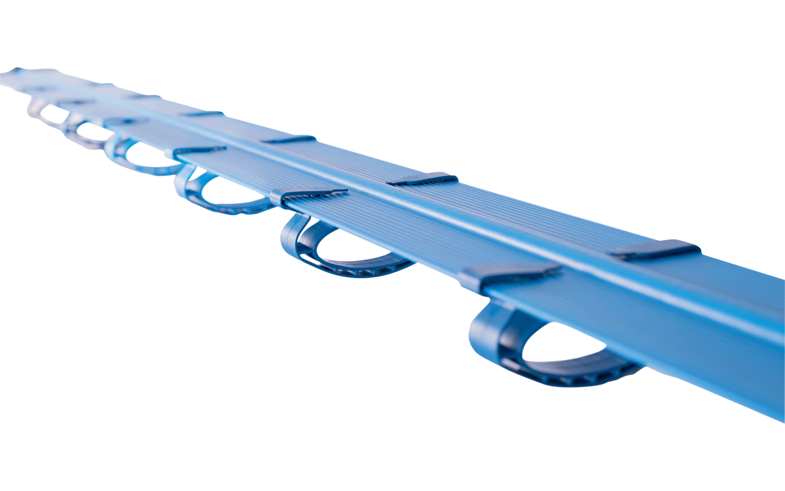 Blue plastic rail with several semicircular loops, on a white background, close-up perspective