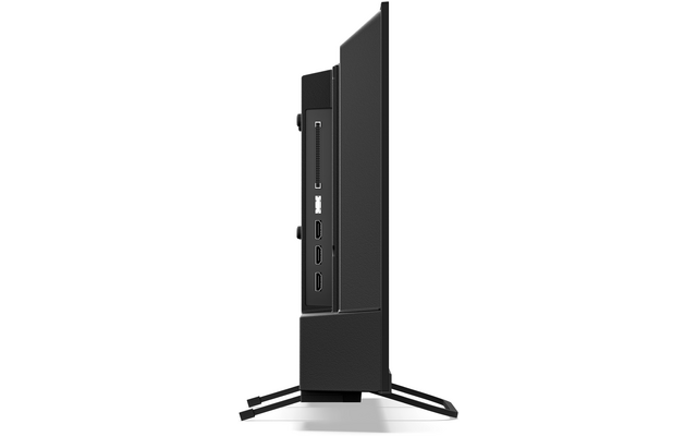 Zijaanzicht van een flatscreen op twee pootjes; aan de zijkant drie HDMI-poorten en een smalle sleuf zichtbaar