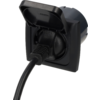 Black recessed outlet with open hinged cover and a black plug with cable inserted
