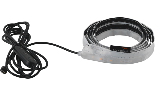 Aufgerolltes flexibles Band mit sichtbaren kleinen rechteckigen LED‑Elementen und einem daran befestigten schwarzen Kabel