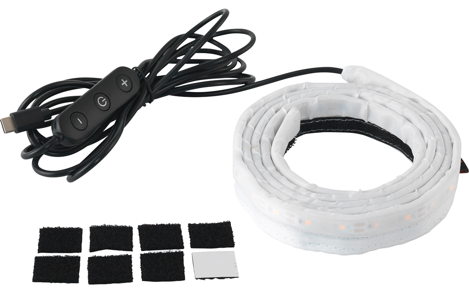 Aufgerolltes weißes Band mit sichtbaren LEDs, schwarzes Kabel mit Inline‑Schalter, mehrere quadratische Klebepads